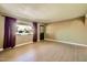 Bright living room featuring wood-look floors, a decorative window and stylish curtains at 1257 W Dublin St, Chandler, AZ 85224