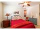 Guest bedroom featuring ceiling fan, cowboy decor, and natural light at 13068 W Mine Trl, Peoria, AZ 85383