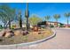 Beautiful landscaping and trees accent the entrance to this desirable community at 13068 W Mine Trl, Peoria, AZ 85383