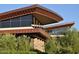 Exterior of building with large windows, stone pillars and interesting angles at 13068 W Mine Trl, Peoria, AZ 85383