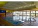 Bright indoor pool area with large windows, several lanes, and easy-access ramp at 13068 W Mine Trl, Peoria, AZ 85383