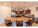 Modern kitchen with granite countertop island and stainless steel appliances for functionality and elegance at 13068 W Mine Trl, Peoria, AZ 85383