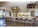 Open-concept kitchen with granite counters, stainless appliances, and an island with breakfast bar at 13068 W Mine Trl, Peoria, AZ 85383