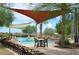 Resort-style pool area with ample seating, shade structures, and a fun, social atmosphere at 13068 W Mine Trl, Peoria, AZ 85383