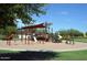 Gathering-friendly playground with swings, slides, and climbing structures under a shade structure at 13068 W Mine Trl, Peoria, AZ 85383