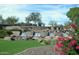 Beautiful water feature with the Trilogy sign set among rocks, plants, and tiered waterfalls at 13068 W Mine Trl, Peoria, AZ 85383