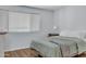 Inviting bedroom with wood floors, bedside table and natural lighting at 14145 N 92Nd St # 2046, Scottsdale, AZ 85260