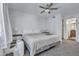 Cozy bedroom features a ceiling fan, and an ensuite bathroom at 14145 N 92Nd St # 2046, Scottsdale, AZ 85260