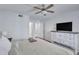Spacious bedroom with a ceiling fan and a large television set at 14145 N 92Nd St # 2046, Scottsdale, AZ 85260