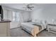 Sunlit bedroom with neutral tones, a large window, and ample storage at 14145 N 92Nd St # 2046, Scottsdale, AZ 85260