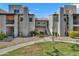 Beautiful two-story condo complex with well-maintained landscaping and inviting walkways at 14145 N 92Nd St # 2046, Scottsdale, AZ 85260