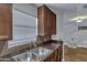 Kitchen area featuring stainless steel sink, ample counter space, and dark cabinetry at 14145 N 92Nd St # 2046, Scottsdale, AZ 85260