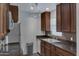 Well-lit kitchen with stainless steel appliances and sleek dark countertops at 14145 N 92Nd St # 2046, Scottsdale, AZ 85260