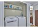 Laundry area featuring a stacked washer and dryer, and extra storage at 14145 N 92Nd St # 2046, Scottsdale, AZ 85260