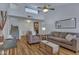 Inviting living room with a ceiling fan, comfortable seating, and stairs leading to an upper level at 14145 N 92Nd St # 2046, Scottsdale, AZ 85260