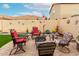 Charming backyard patio featuring a fire pit, colorful seating, and decorative accents at 1557 S Halsted Dr, Chandler, AZ 85286