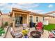 Inviting backyard patio with comfortable seating, a fire pit, and a covered area for relaxing at 1557 S Halsted Dr, Chandler, AZ 85286