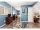 Bright bedroom featuring a mirrored closet, blue walls, and stylish decor on wood-look floors at 1557 S Halsted Dr, Chandler, AZ 85286