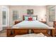Cozy bedroom featuring hardwood floors and wood furnishings beneath a chandelier at 1557 S Halsted Dr, Chandler, AZ 85286