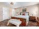 Comfortable bedroom with hardwood floors, chandelier, and a coordinating furniture set at 1557 S Halsted Dr, Chandler, AZ 85286