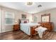 Comfortable bedroom with hardwood floors, chandelier, and a coordinating furniture set at 1557 S Halsted Dr, Chandler, AZ 85286