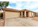 Charming single-story home featuring a low-maintenance front yard, two-car garage and covered porch at 1557 S Halsted Dr, Chandler, AZ 85286