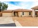 Charming single-story home featuring a low-maintenance front yard, two-car garage and covered porch at 1557 S Halsted Dr, Chandler, AZ 85286