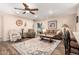 Cozy living room featuring a ceiling fan, beautiful decor, and an eye-catching patterned rug at 1557 S Halsted Dr, Chandler, AZ 85286