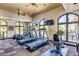 Well-equipped gym with cardio machines, large windows, and views at 15802 N 71St St # 311, Scottsdale, AZ 85254