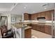 Modern kitchen with granite countertops, stainless steel appliances, and custom cabinets at 15802 N 71St St # 311, Scottsdale, AZ 85254