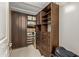 This walk-in closet features custom built-ins and lots of storage space at 15802 N 71St St # 311, Scottsdale, AZ 85254