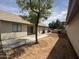 View of backyard with patio area and tree providing shade; great potential for outdoor entertaining at 1620 E Jacinto Ave, Mesa, AZ 85204