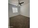 Bright bedroom with carpet flooring and a window, creating a comfortable living space at 1620 E Jacinto Ave, Mesa, AZ 85204