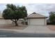 Charming single-story home featuring a well-manicured front yard and a two-car garage at 1620 E Jacinto Ave, Mesa, AZ 85204