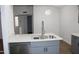 Contemporary kitchen featuring stainless dishwasher, modern faucet, and gray lower cabinets at 1620 E Jacinto Ave, Mesa, AZ 85204