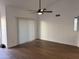 Bright living room featuring hardwood flooring, vaulted ceilings, and a ceiling fan at 1620 E Jacinto Ave, Mesa, AZ 85204