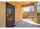 Back patio features a security door and view of the backyard at 16238 N 22Nd Ln, Phoenix, AZ 85023