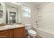 Bright bathroom features a single sink, toilet, and shower-tub combination at 16238 N 22Nd Ln, Phoenix, AZ 85023