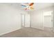 Bedroom featuring neutral carpet, multiple closets, and bright light fixture at 16238 N 22Nd Ln, Phoenix, AZ 85023