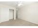 Bedroom featuring neutral carpet, closet, and bright light fixture at 16238 N 22Nd Ln, Phoenix, AZ 85023