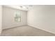 Bedroom featuring neutral carpet, a window, and a modern ceiling fan at 16238 N 22Nd Ln, Phoenix, AZ 85023