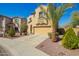 Beautiful front exterior showcasing desert landscaping and a two-car garage at 16238 N 22Nd Ln, Phoenix, AZ 85023