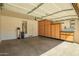 Spacious garage features built-in storage cabinets and shelving at 16238 N 22Nd Ln, Phoenix, AZ 85023