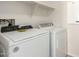 Well-equipped laundry room has modern, front-loading washer and dryer at 16238 N 22Nd Ln, Phoenix, AZ 85023