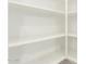 Walk-in pantry featuring multiple white shelves at 16238 N 22Nd Ln, Phoenix, AZ 85023