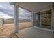 View of the backyard with cinder block fence and dirt at 17567 W Adams St, Goodyear, AZ 85338