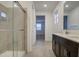 Contemporary bathroom featuring a shower with a glass enclosure and double sink vanity at 17567 W Adams St, Goodyear, AZ 85338