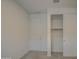 Neutral bedroom featuring plush carpet, a closet, and a standard door at 17567 W Adams St, Goodyear, AZ 85338
