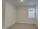 An empty bedroom is bright with a window for natural light at 17567 W Adams St, Goodyear, AZ 85338