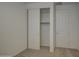 Bedroom features a sliding closet door and standard door at 17567 W Adams St, Goodyear, AZ 85338